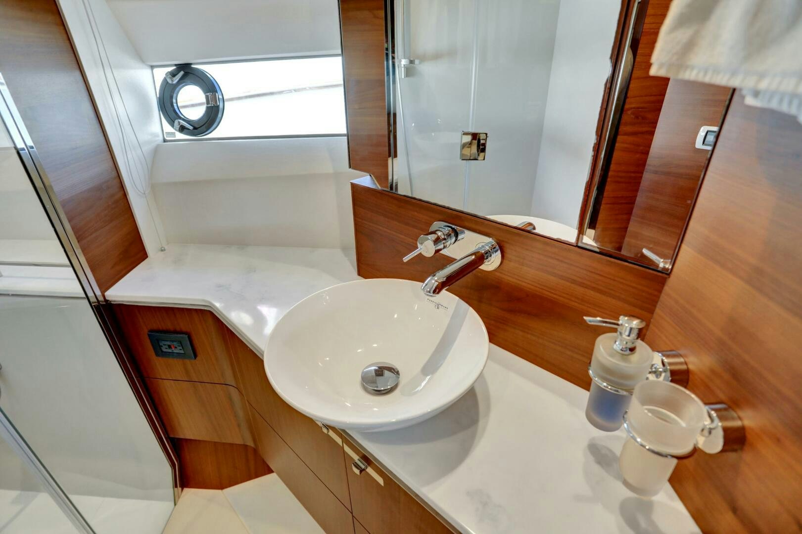 a bathroom with a sink and a mirror aboard REAL SLICK Yacht for Sale