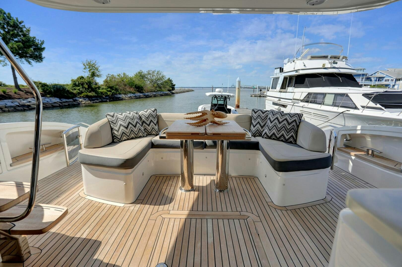 a table and chairs on a deck aboard REAL SLICK Yacht for Sale