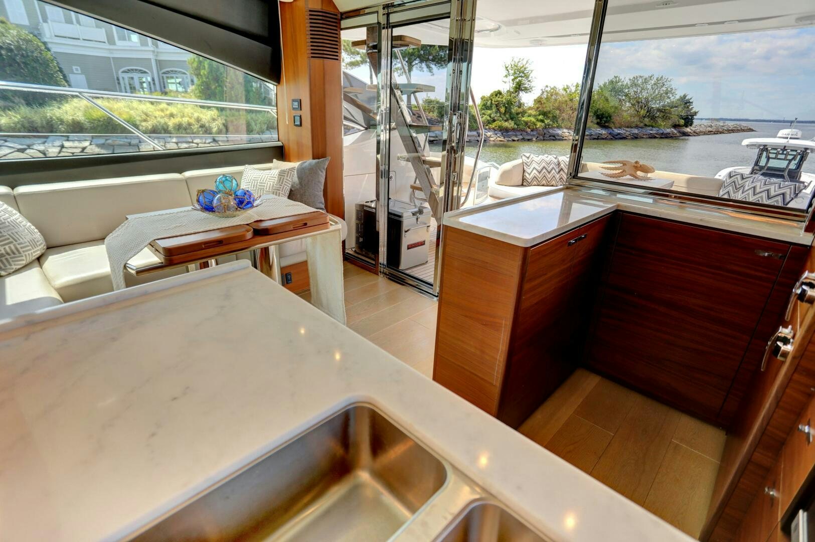 a kitchen with a view of the ocean aboard REAL SLICK Yacht for Sale