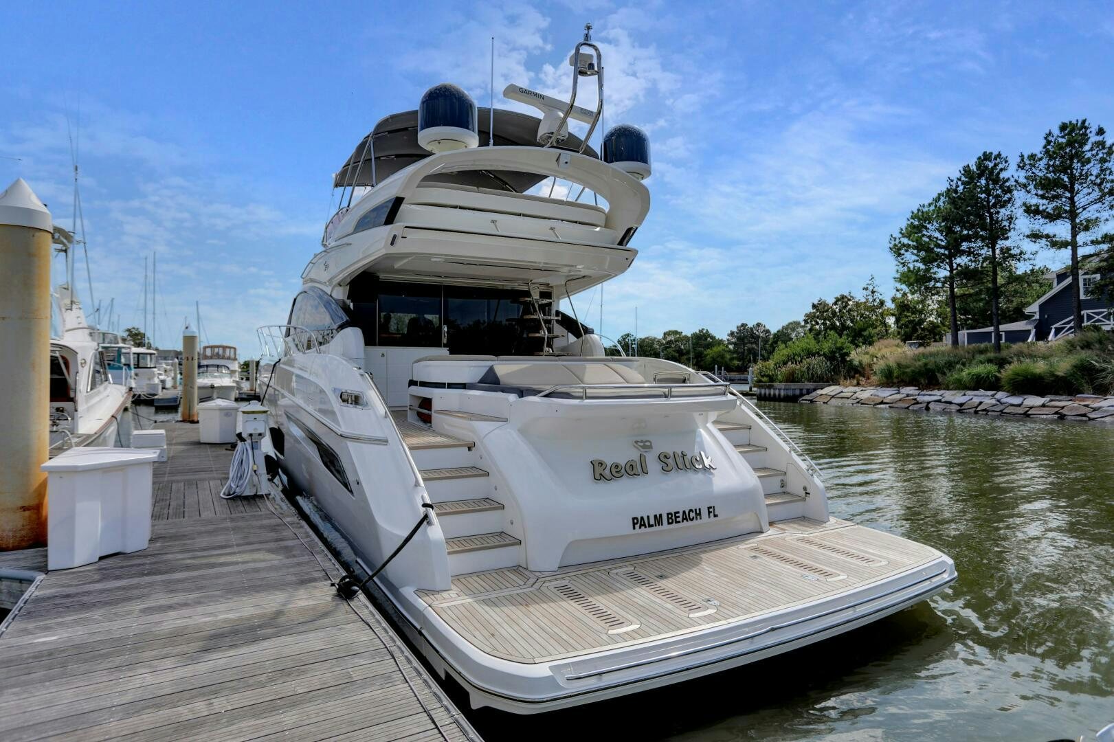 a boat docked at a pier aboard REAL SLICK Yacht for Sale
