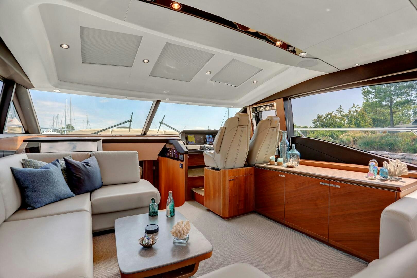 a room with a couch and a table aboard REAL SLICK Yacht for Sale