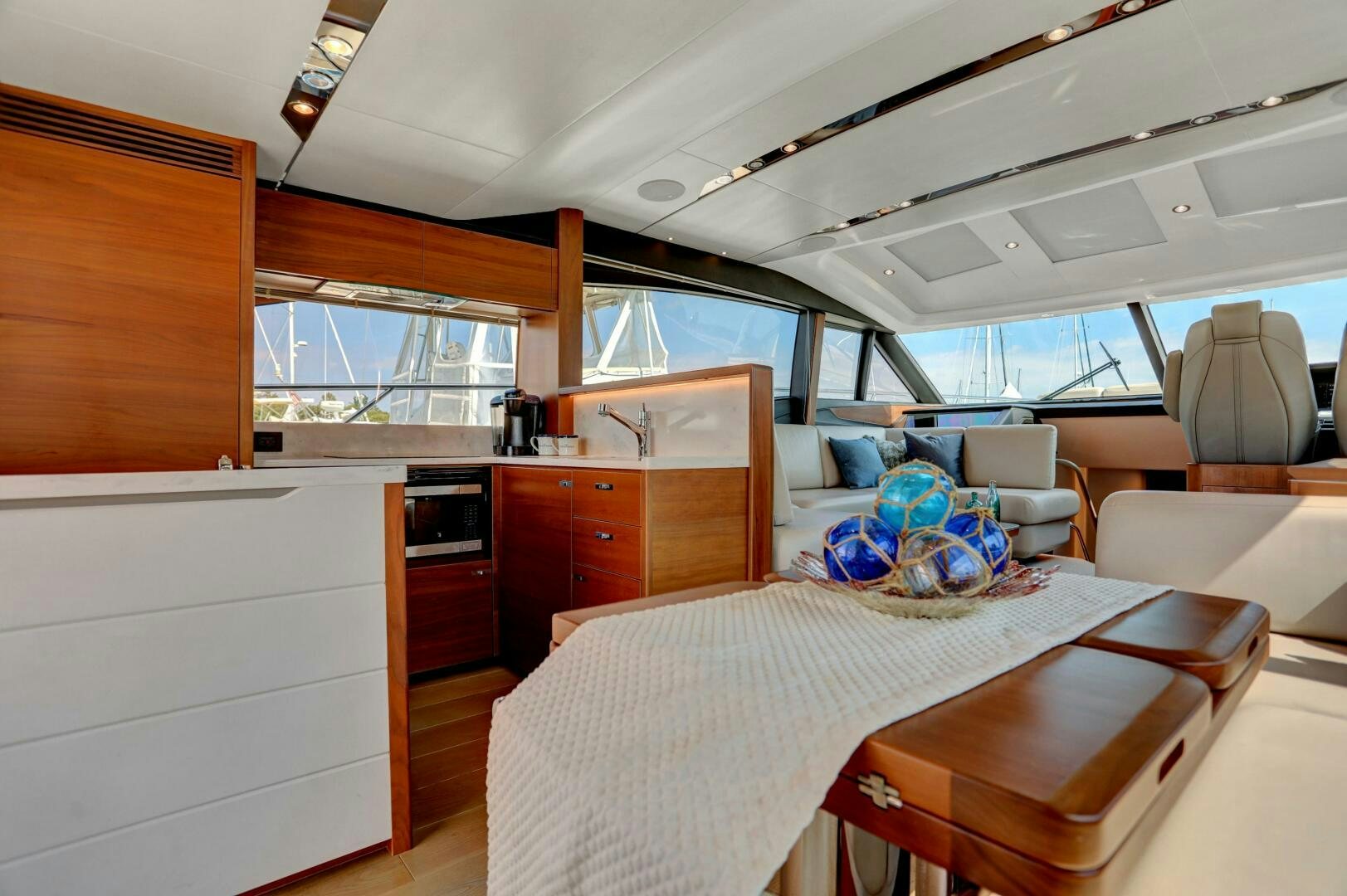a room with a table and chairs aboard REAL SLICK Yacht for Sale