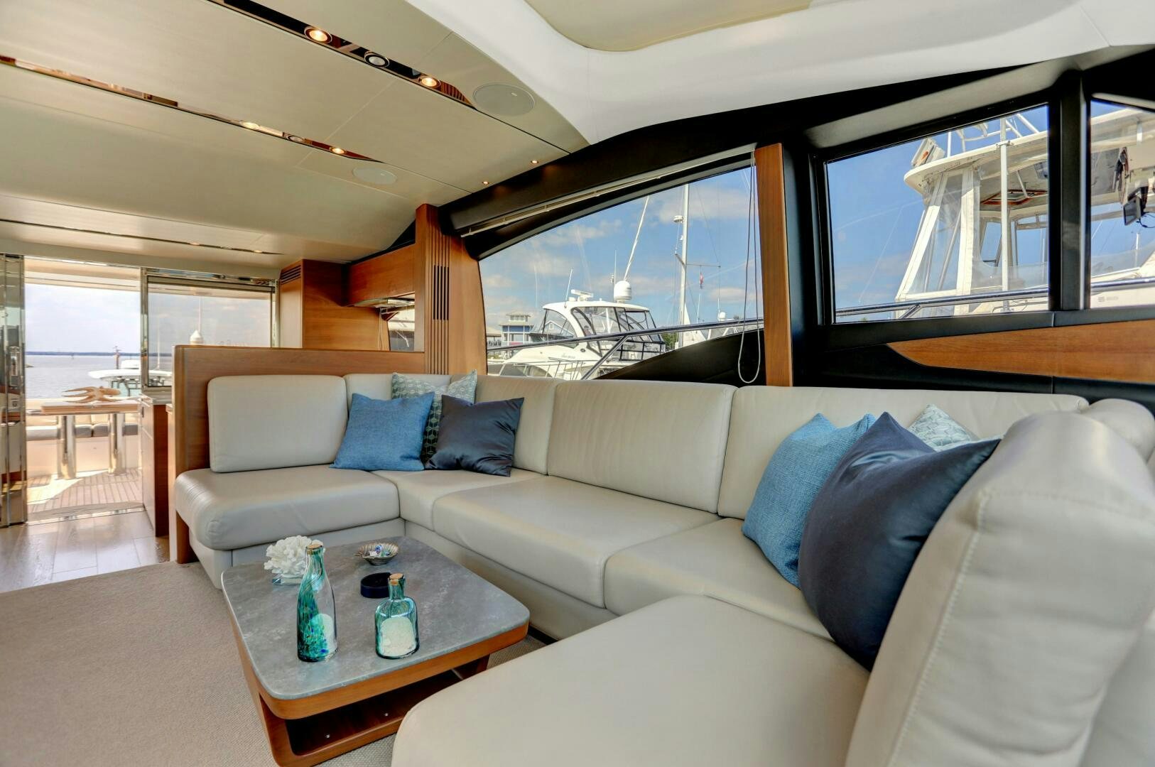 a living room with a couch and a table aboard REAL SLICK Yacht for Sale