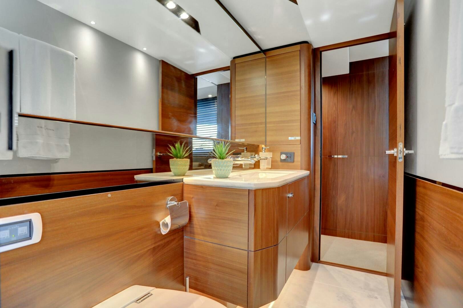 a kitchen with wooden cabinets aboard REAL SLICK Yacht for Sale