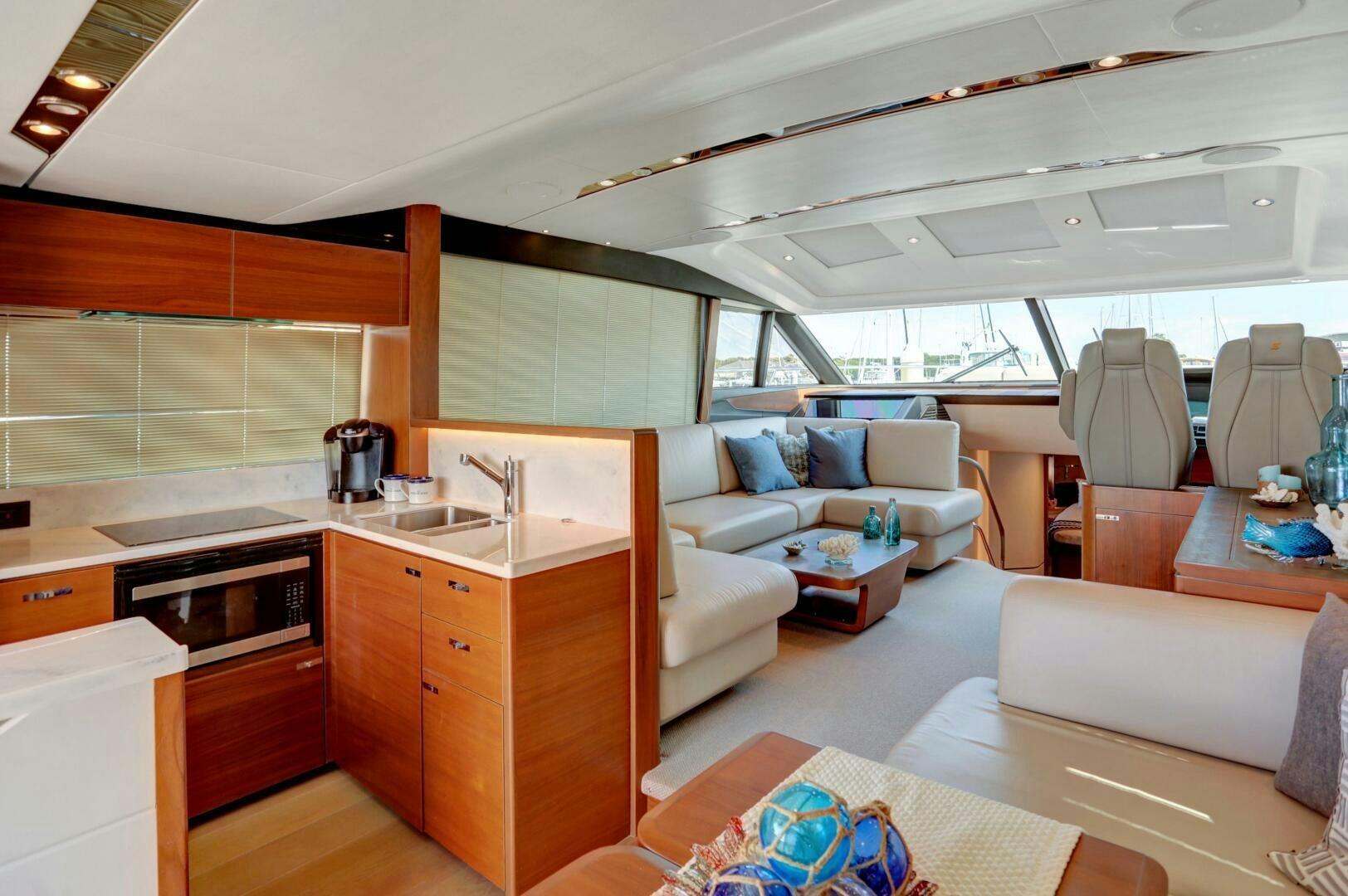 a kitchen with a couch and a table aboard REAL SLICK Yacht for Sale