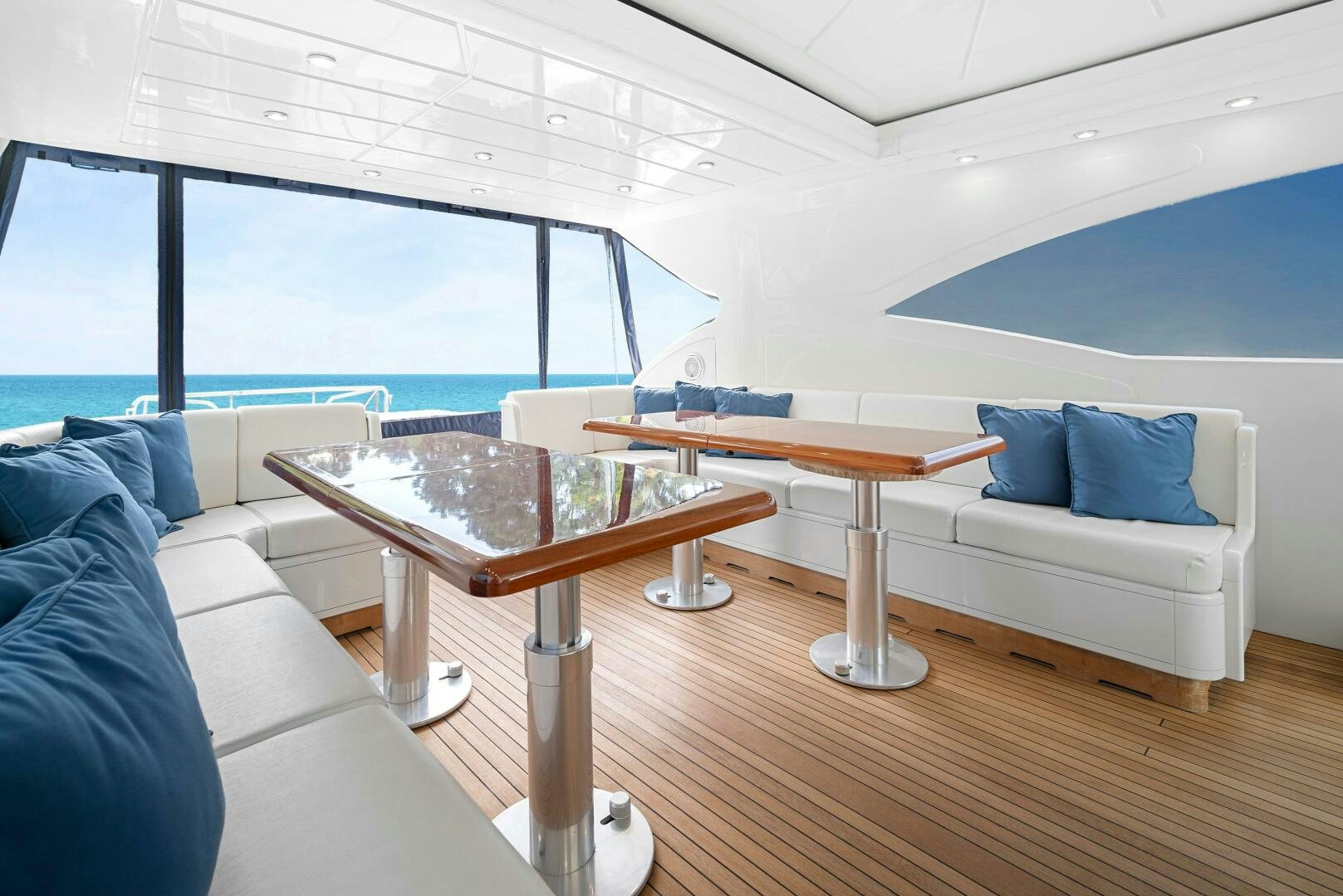a room with a table and a couch aboard NONE Yacht for Sale