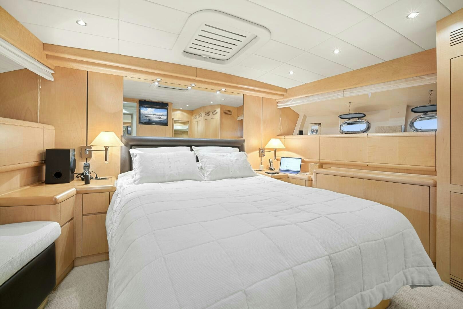 a bedroom with a bed and a desk aboard NONE Yacht for Sale