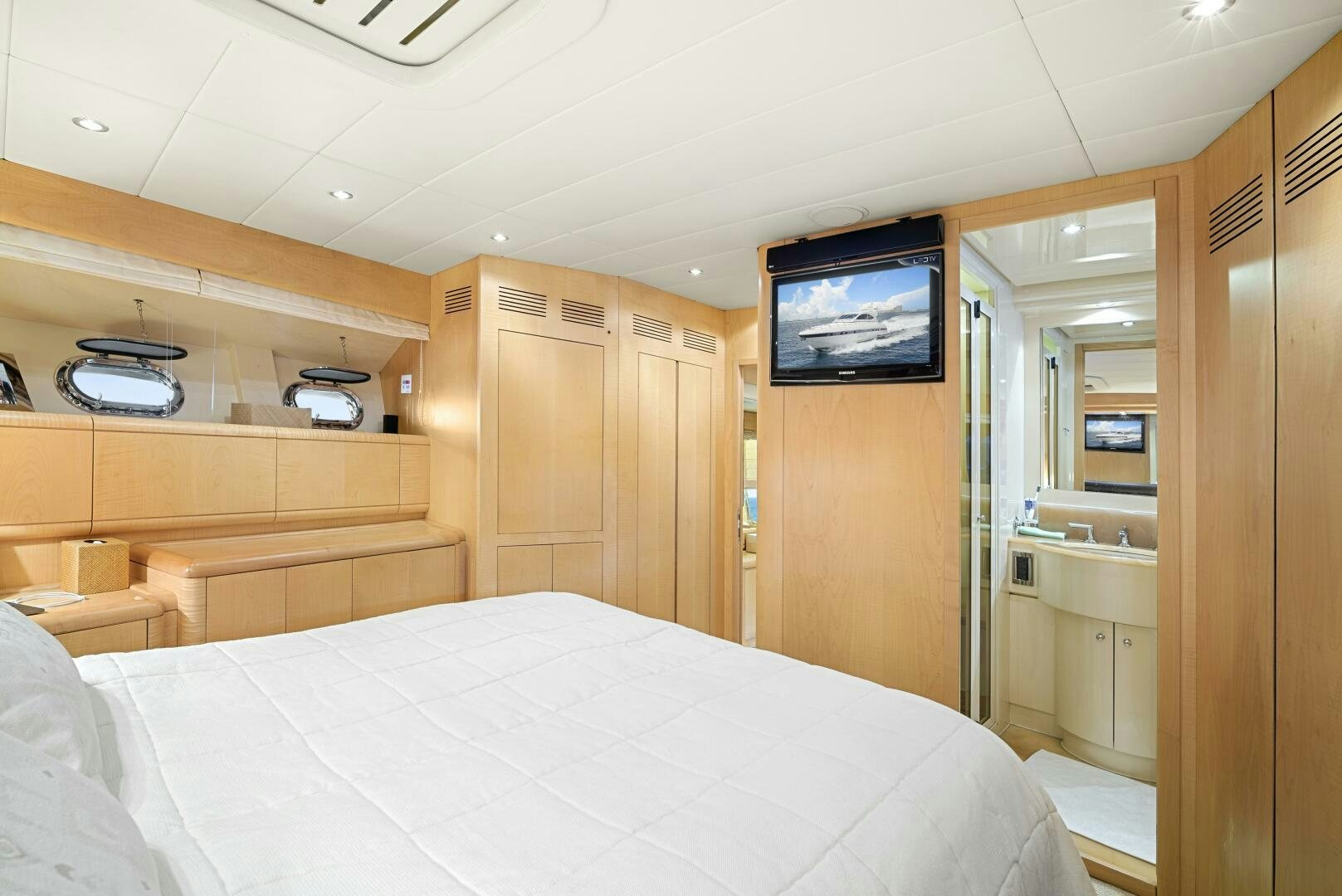 a room with a bed and a television aboard NONE Yacht for Sale