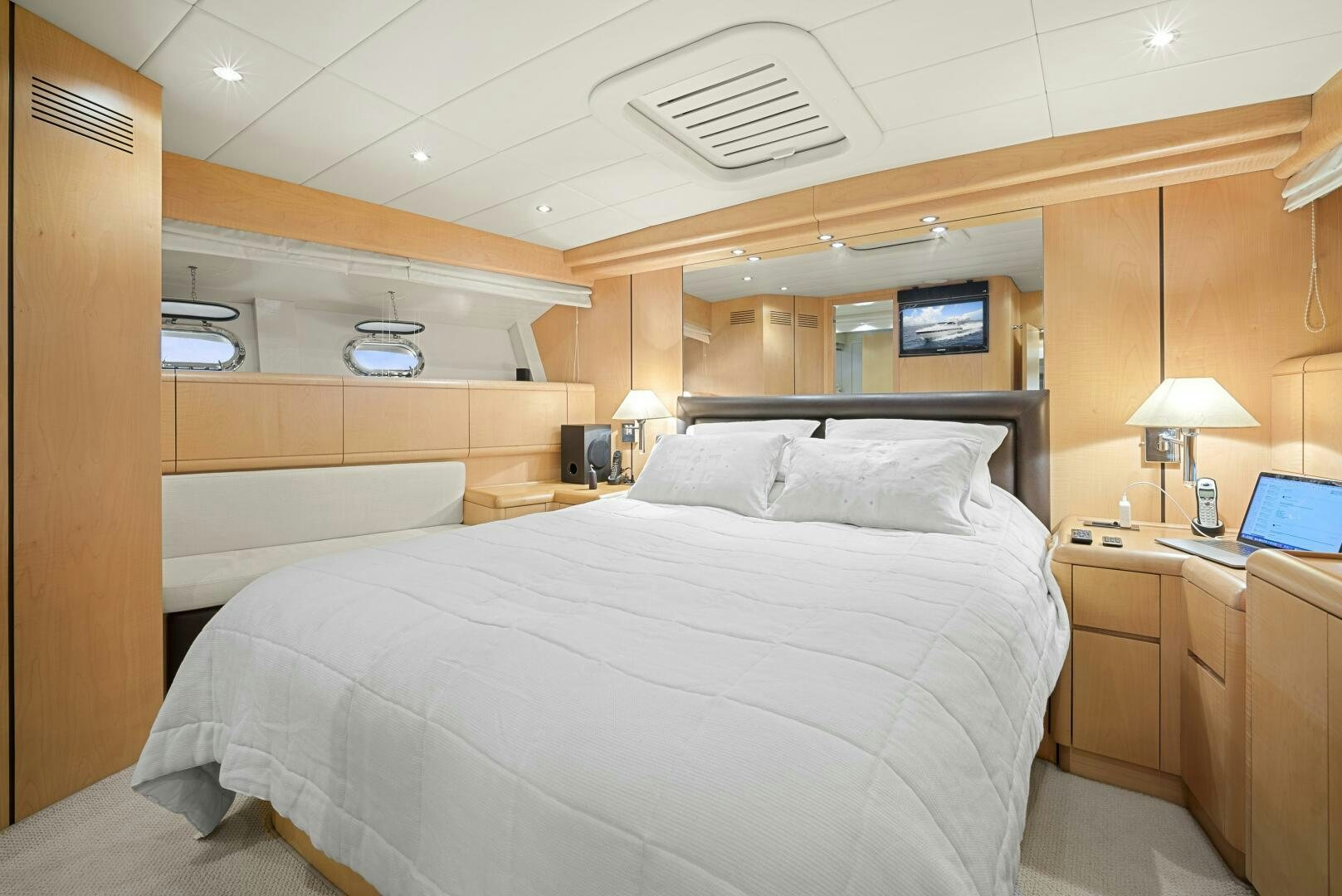 a room with a bed and a desk aboard NONE Yacht for Sale