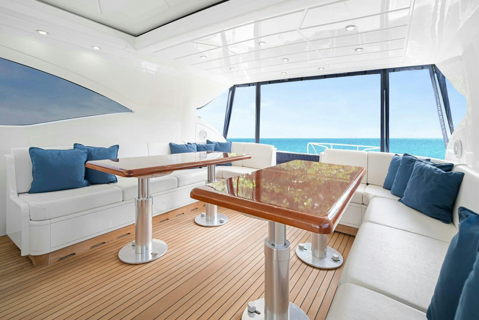 a room with a table and chairs aboard NONE Yacht for Sale