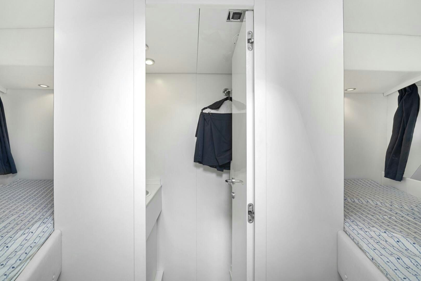 a white bathroom with a white door aboard NONE Yacht for Sale