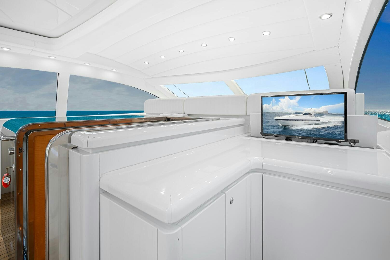 a white room with a television on the ceiling aboard NONE Yacht for Sale