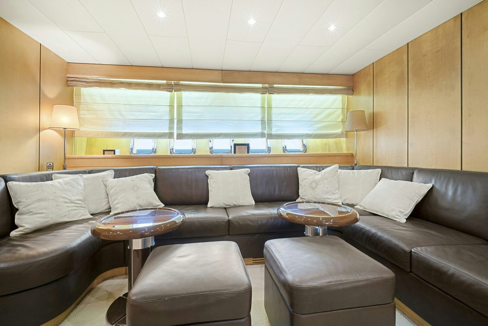 a living room with a leather couch aboard NONE Yacht for Sale