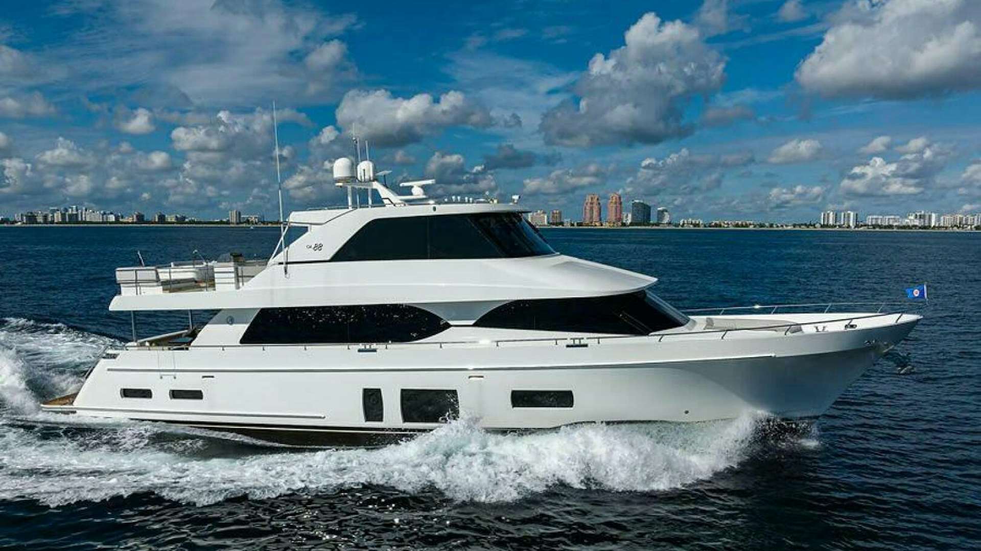 a white yacht on the water aboard GG Yacht for Sale
