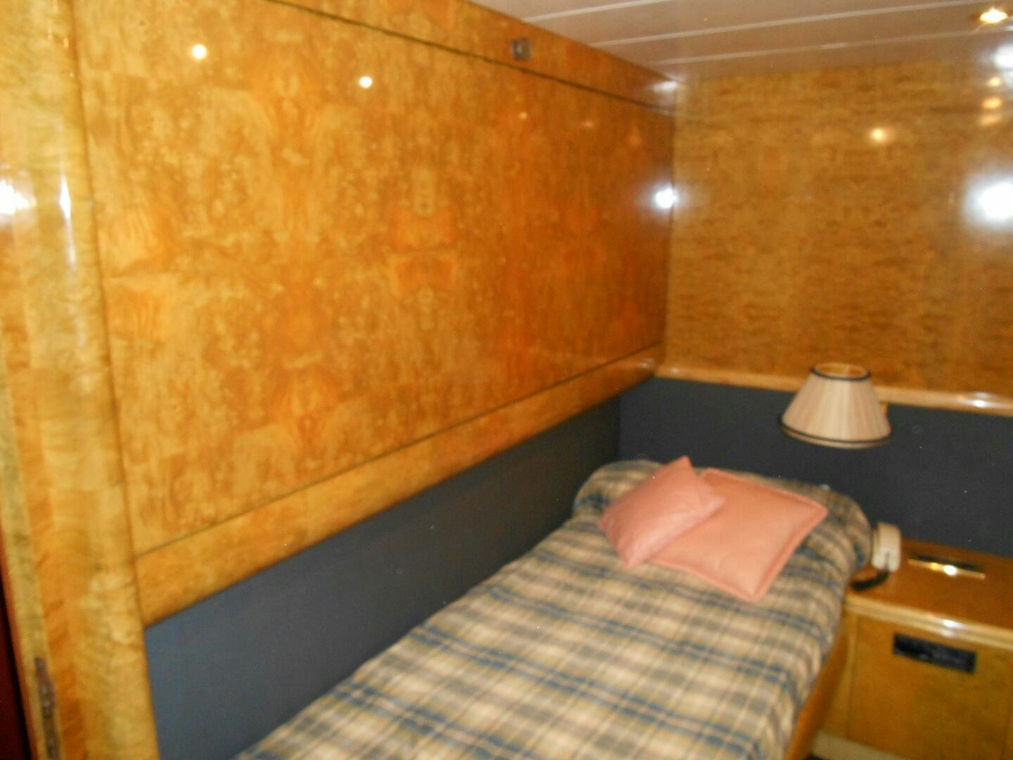 a bed with a pillow on it aboard LADY C Yacht for Sale