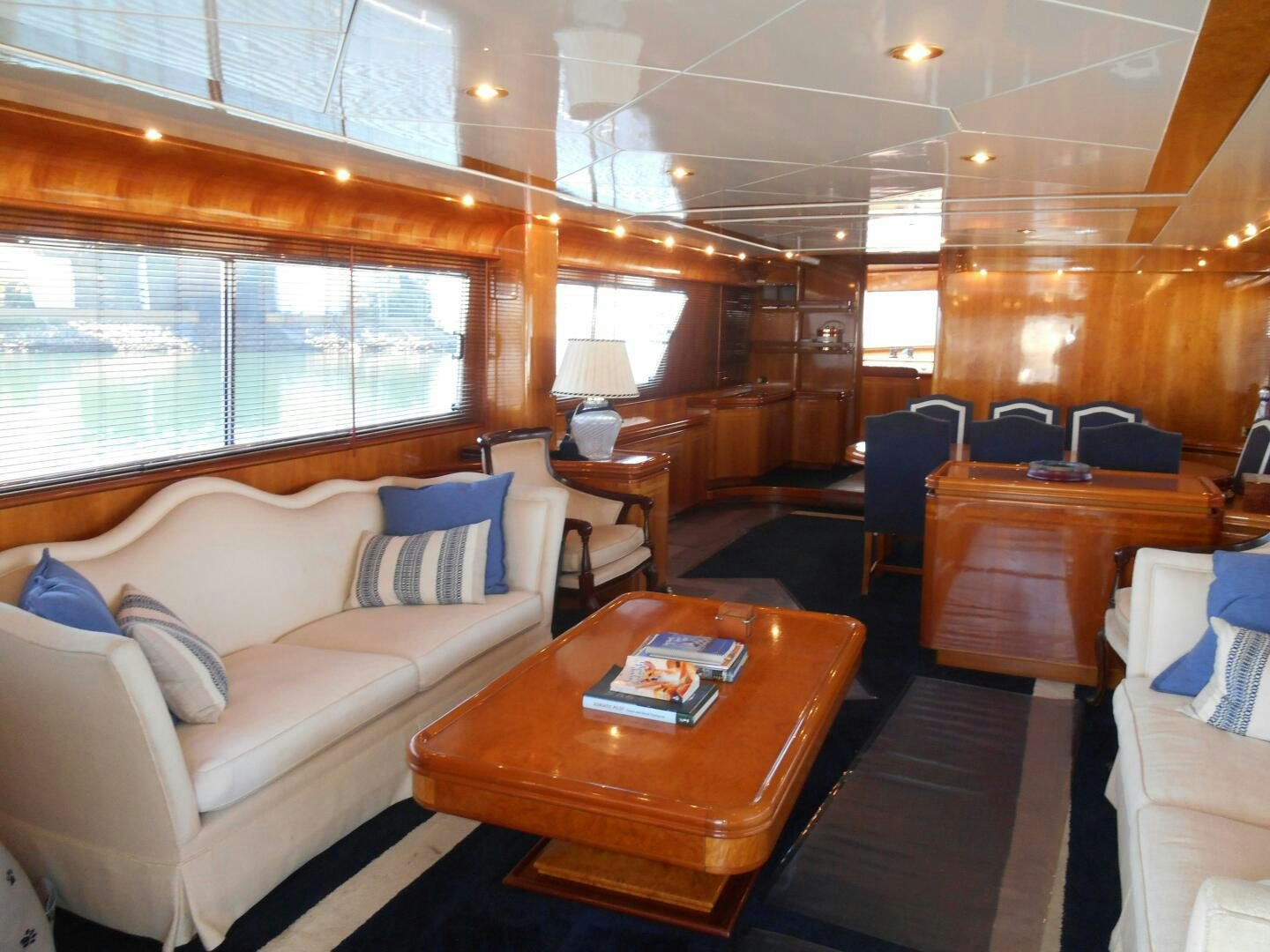 a room with a couch and a table aboard LADY C Yacht for Sale