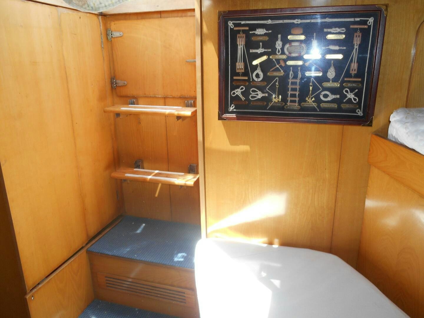 a small bathroom with a chalkboard aboard LADY C Yacht for Sale