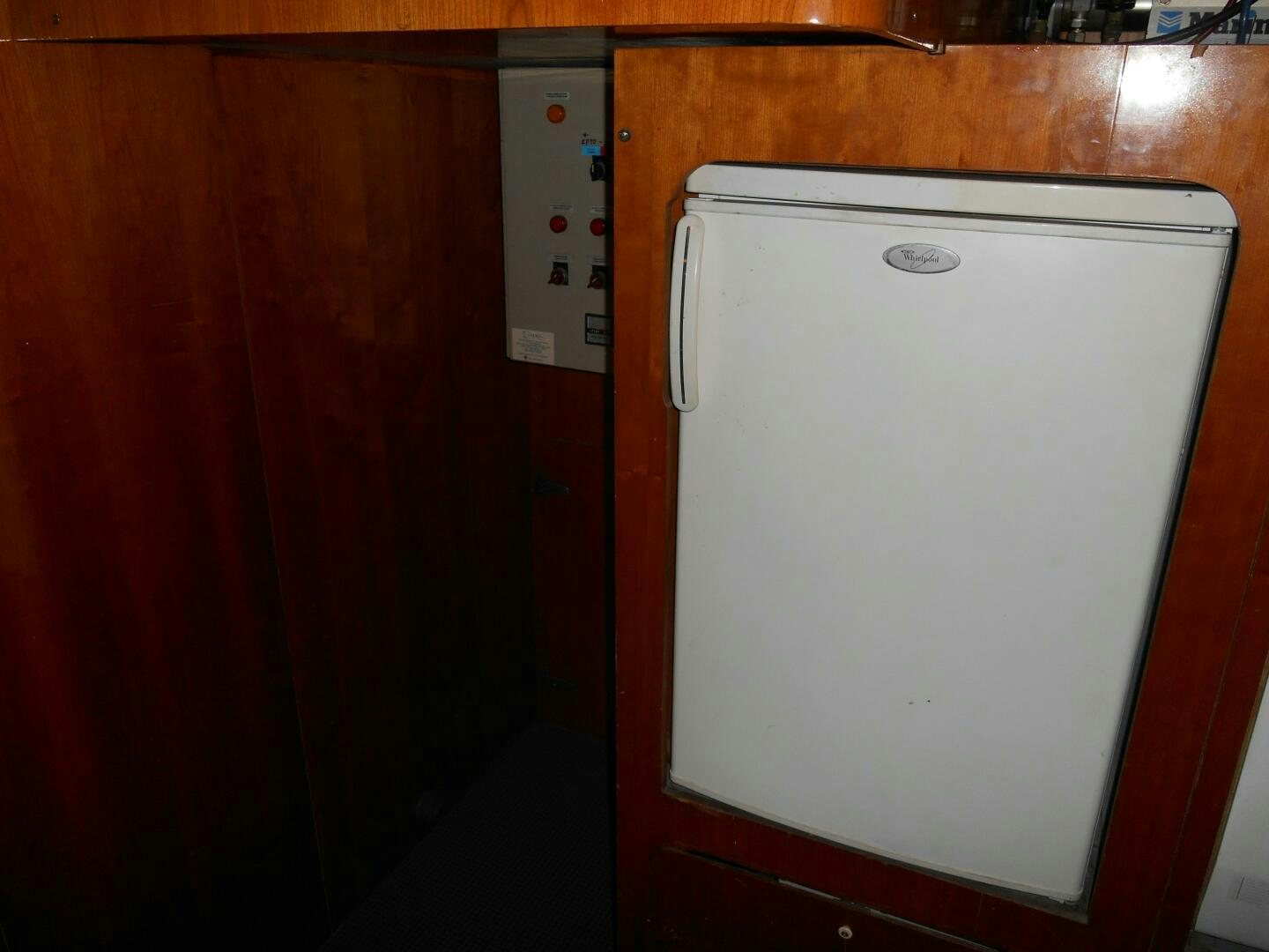 a white rectangular object on a wooden surface aboard LADY C Yacht for Sale