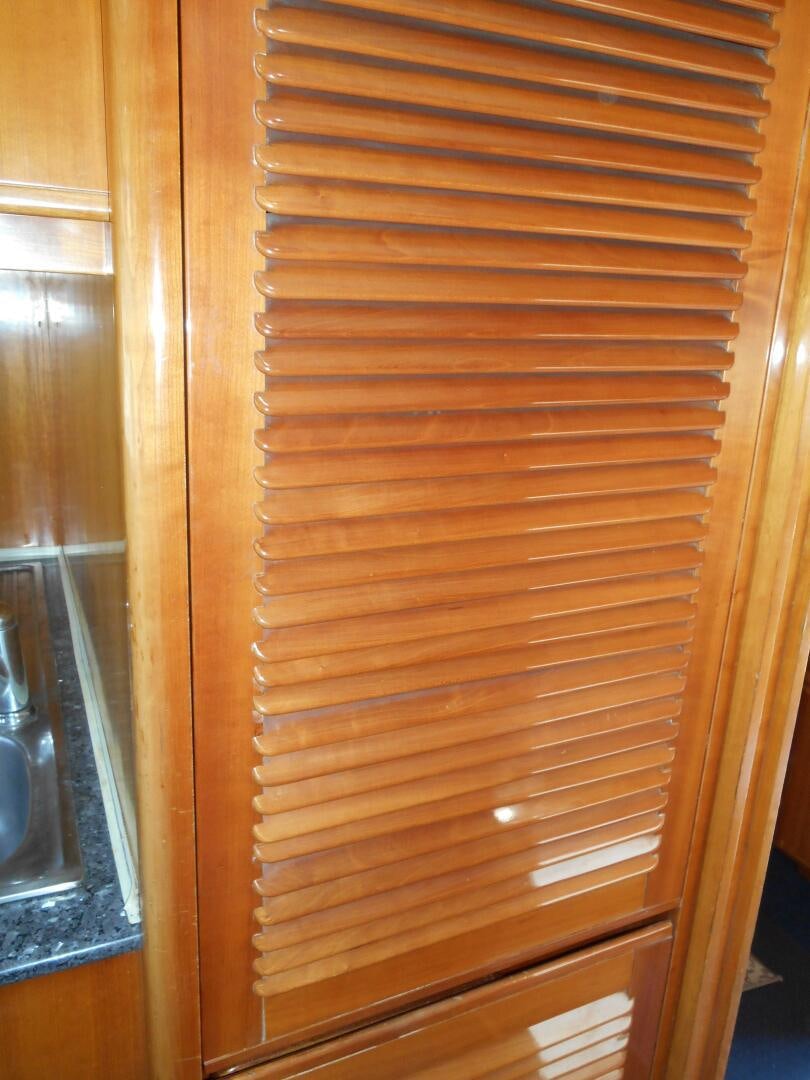 a wooden door with a handle aboard LADY C Yacht for Sale