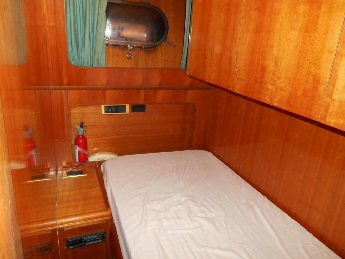 a bed in a room aboard LADY C Yacht for Sale