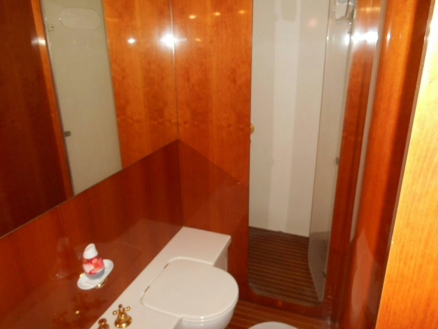 a bathroom with a sink and a shower aboard LADY C Yacht for Sale