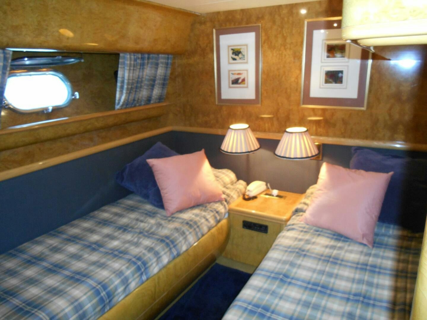 a couple of beds in a hotel room aboard LADY C Yacht for Sale