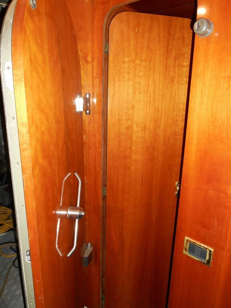 a wooden door with a handle aboard LADY C Yacht for Sale