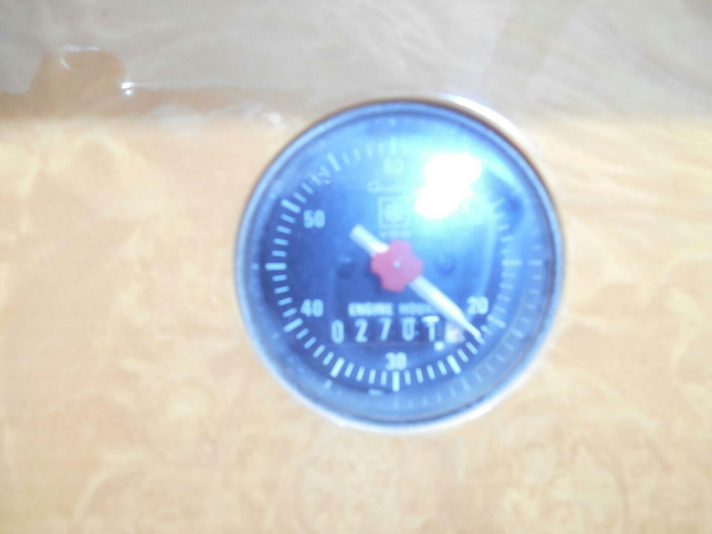 a blue watch on a white surface aboard LADY C Yacht for Sale