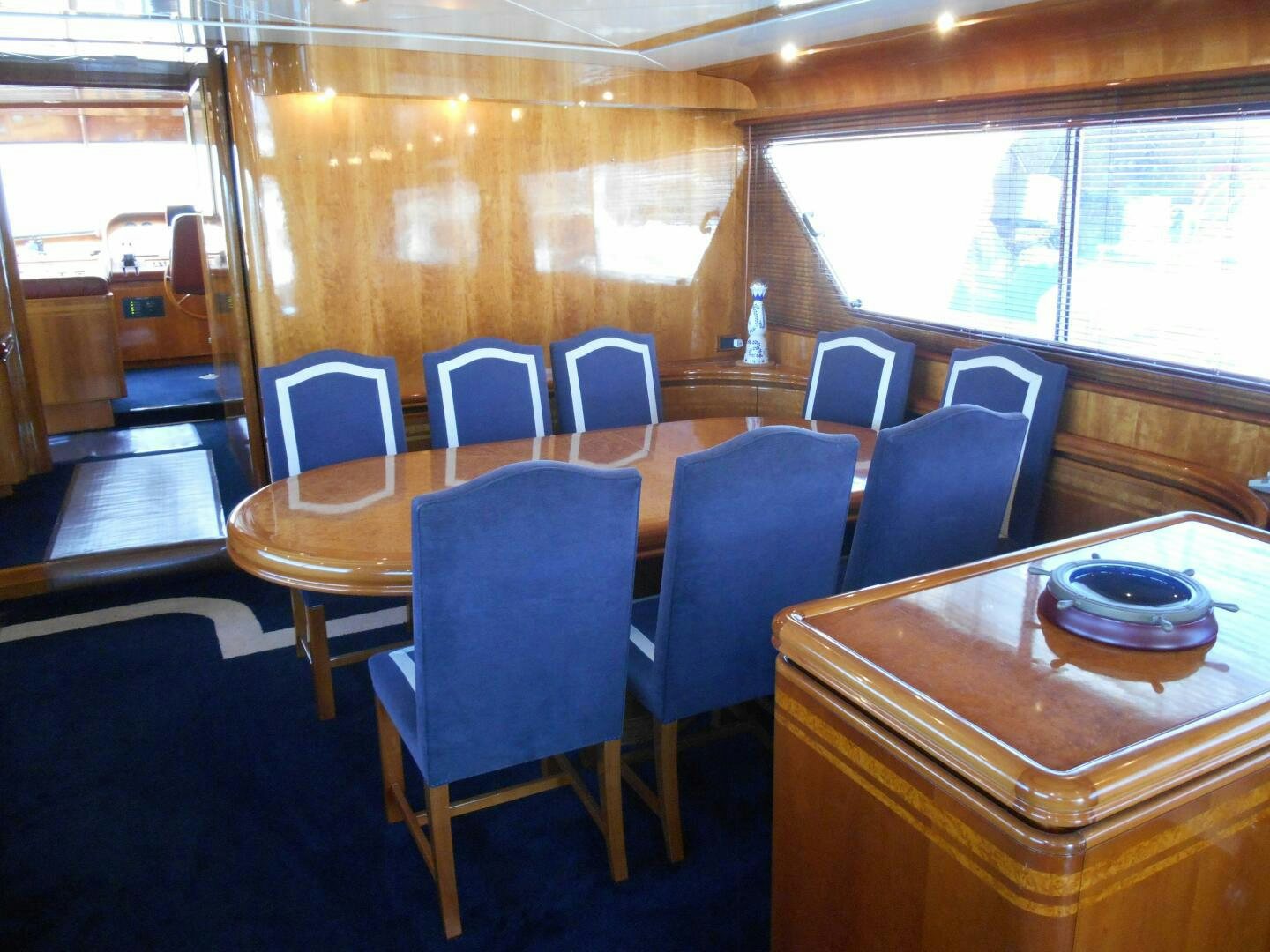 a room with a table and chairs aboard LADY C Yacht for Sale