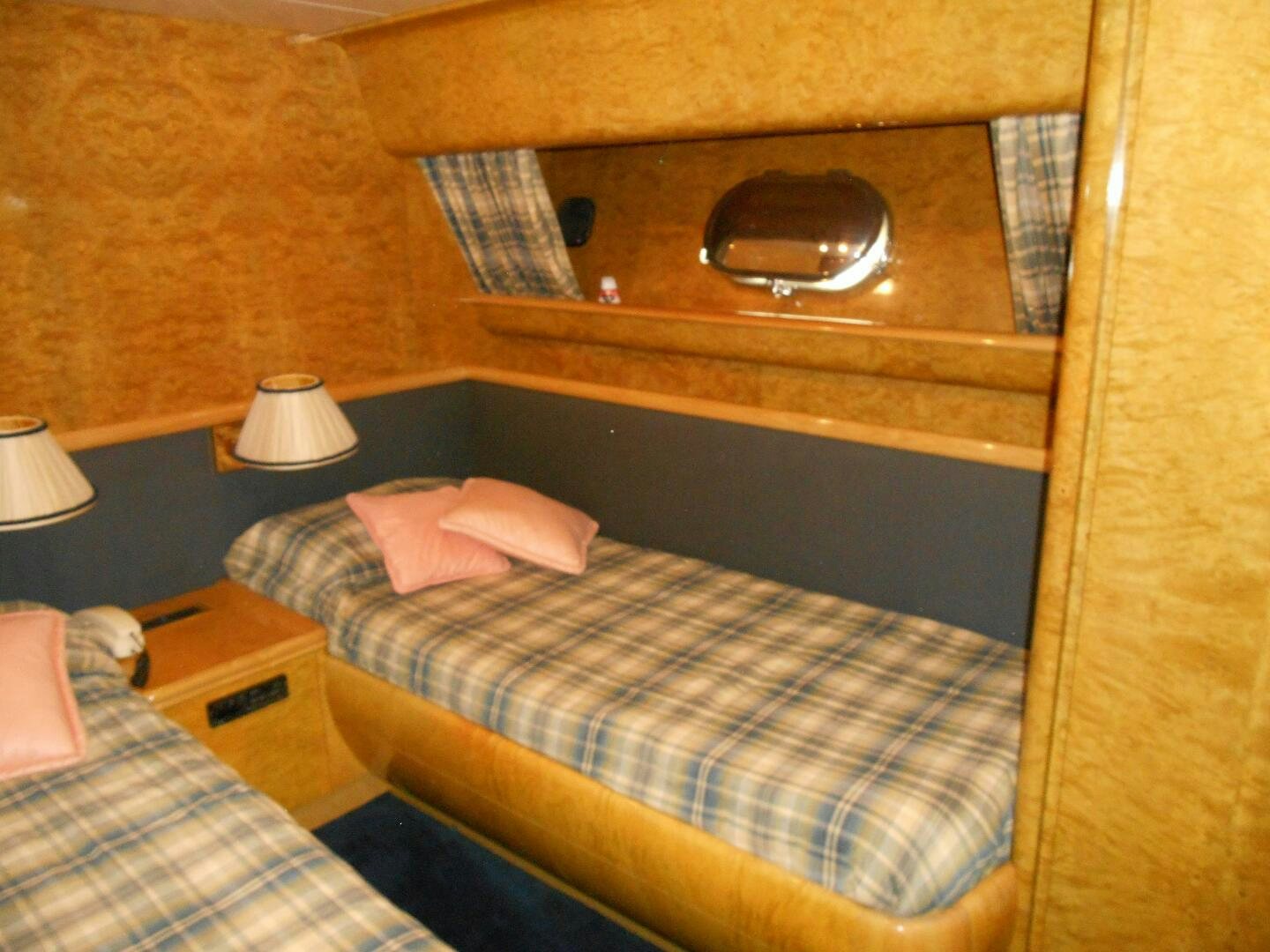 a bed with a television on top of it aboard LADY C Yacht for Sale