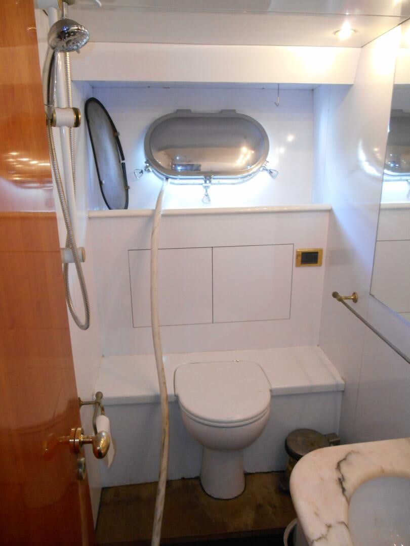 a bathroom with a sink and toilet aboard LADY C Yacht for Sale