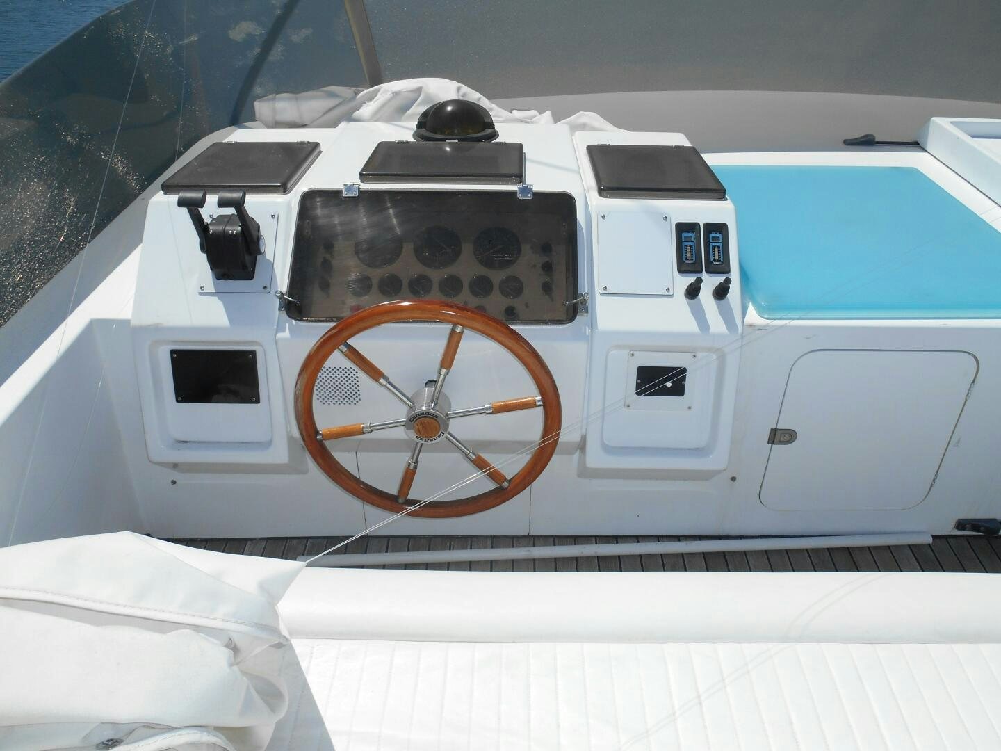 a white and blue vehicle aboard LADY C Yacht for Sale