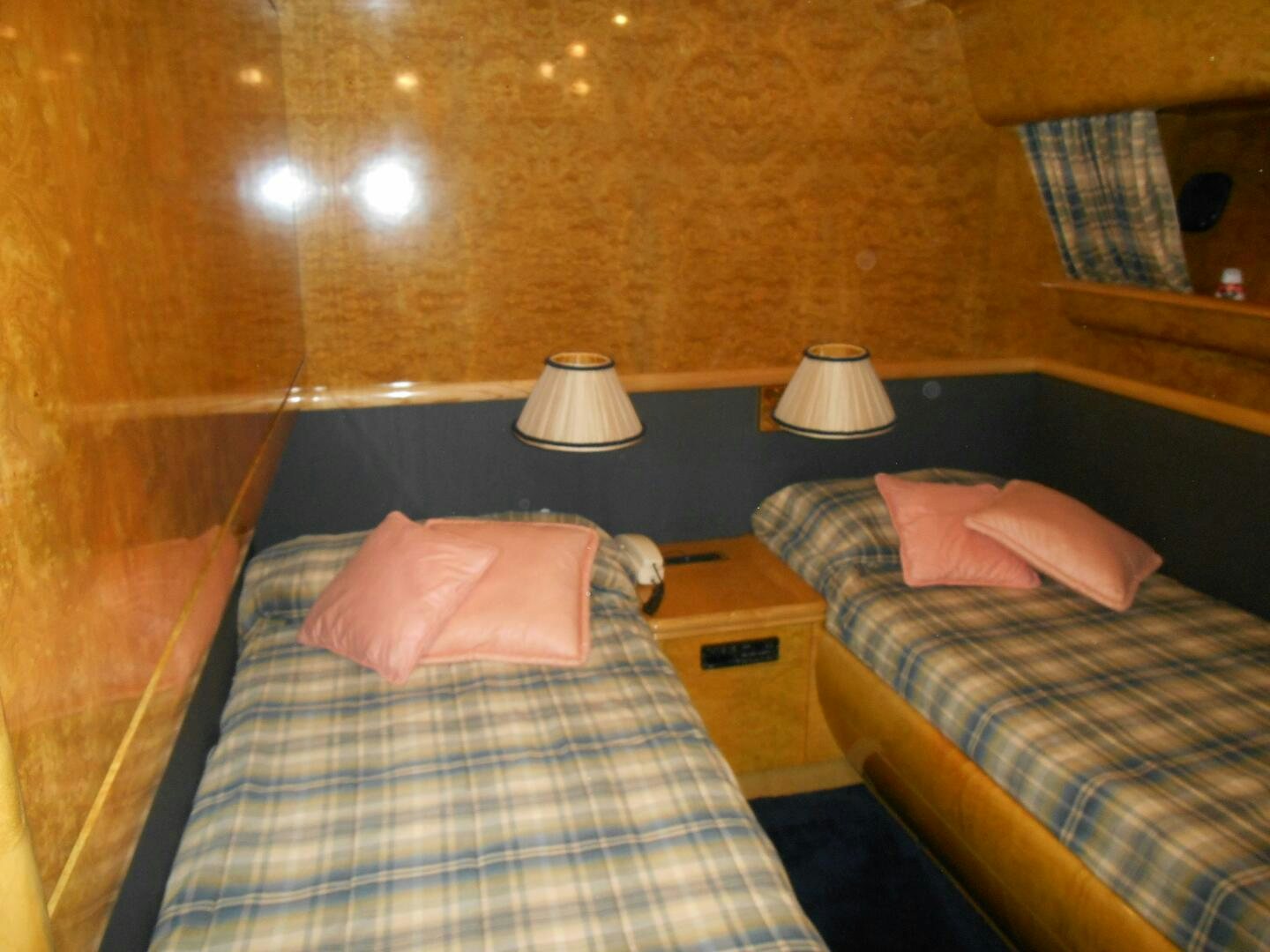 a couple of beds in a room aboard LADY C Yacht for Sale
