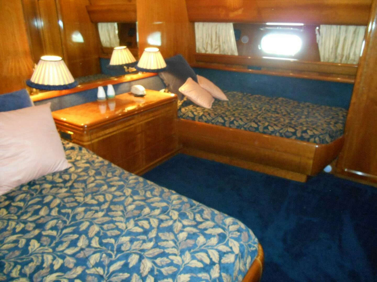 a hotel room with two beds aboard LADY C Yacht for Sale