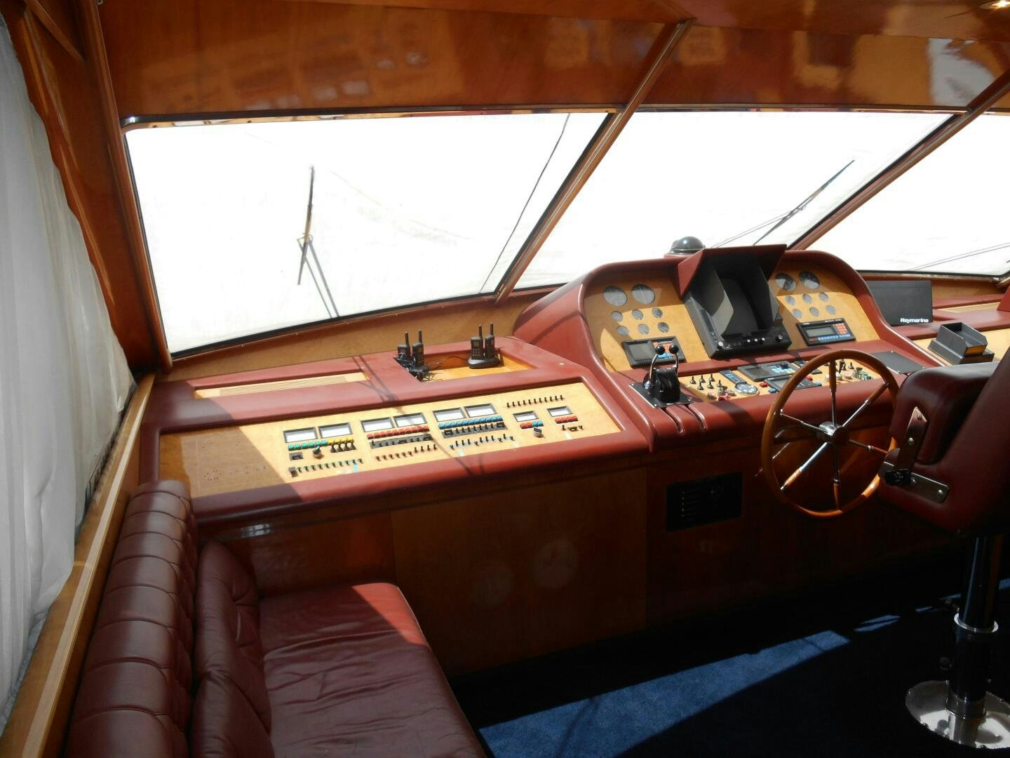 a wooden boat with a radio and a radio aboard LADY C Yacht for Sale