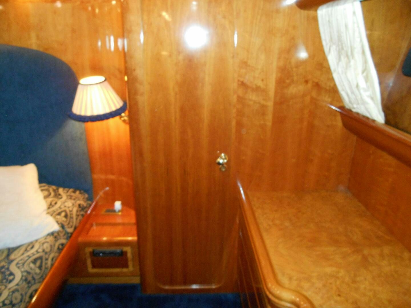 a wooden door in a room aboard LADY C Yacht for Sale