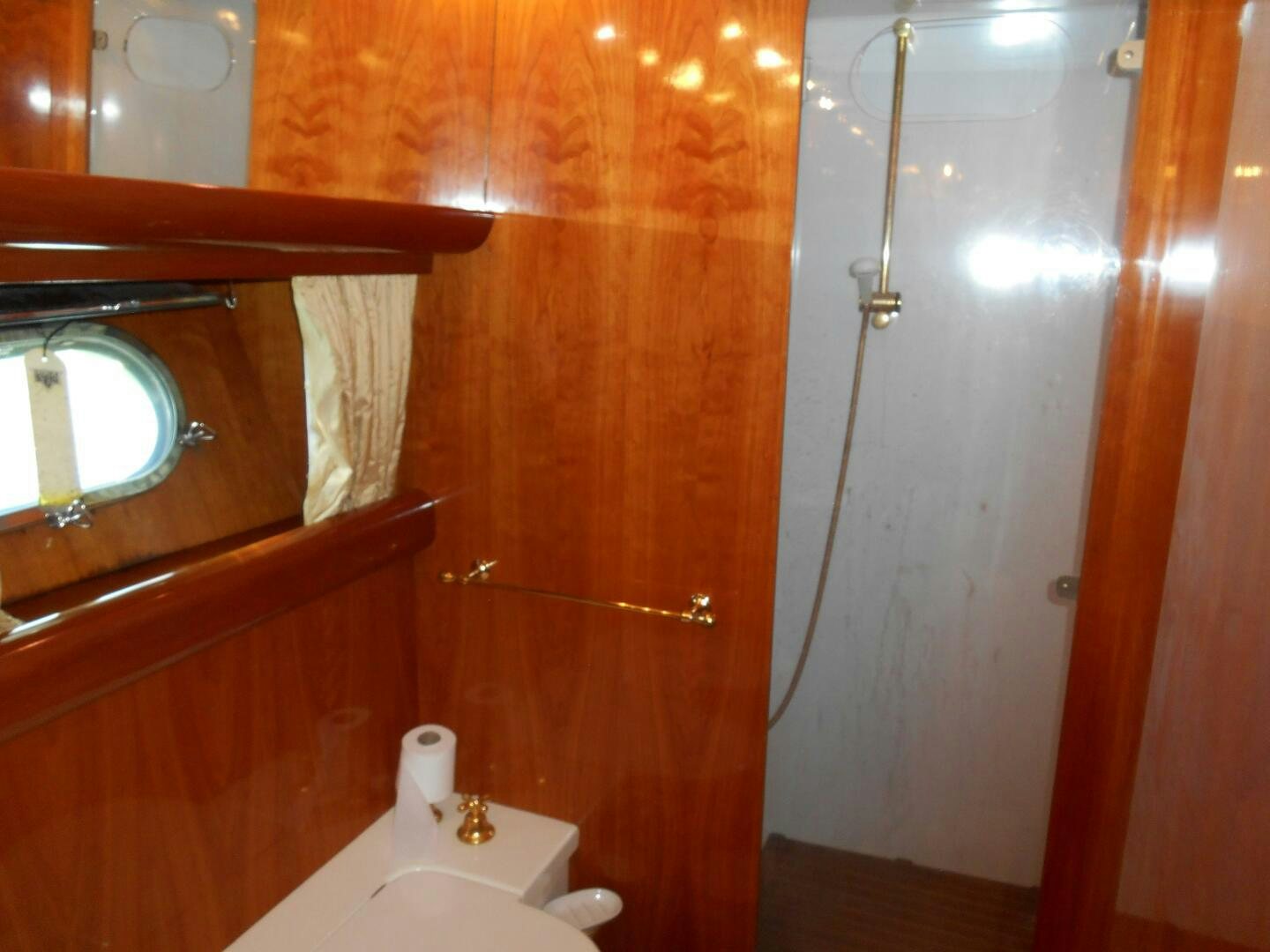 a bathroom with a sink and a shower aboard LADY C Yacht for Sale