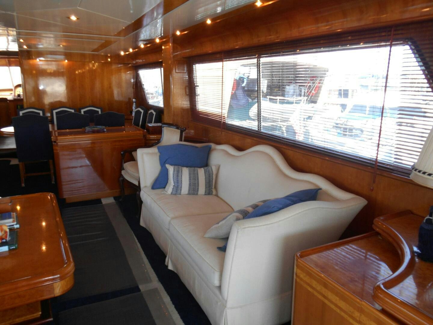 a room with a couch and a window aboard LADY C Yacht for Sale