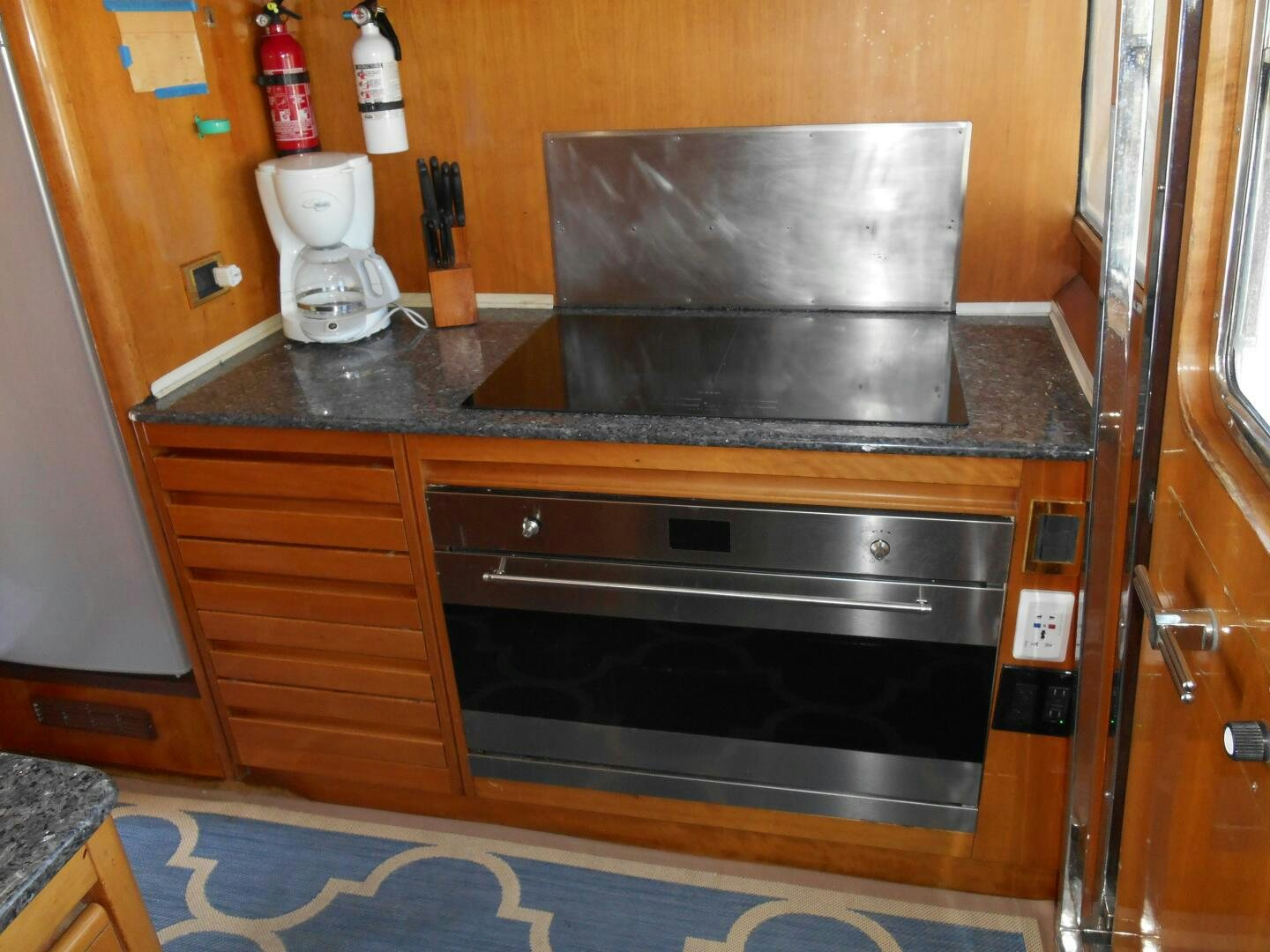 a kitchen with a large oven aboard LADY C Yacht for Sale