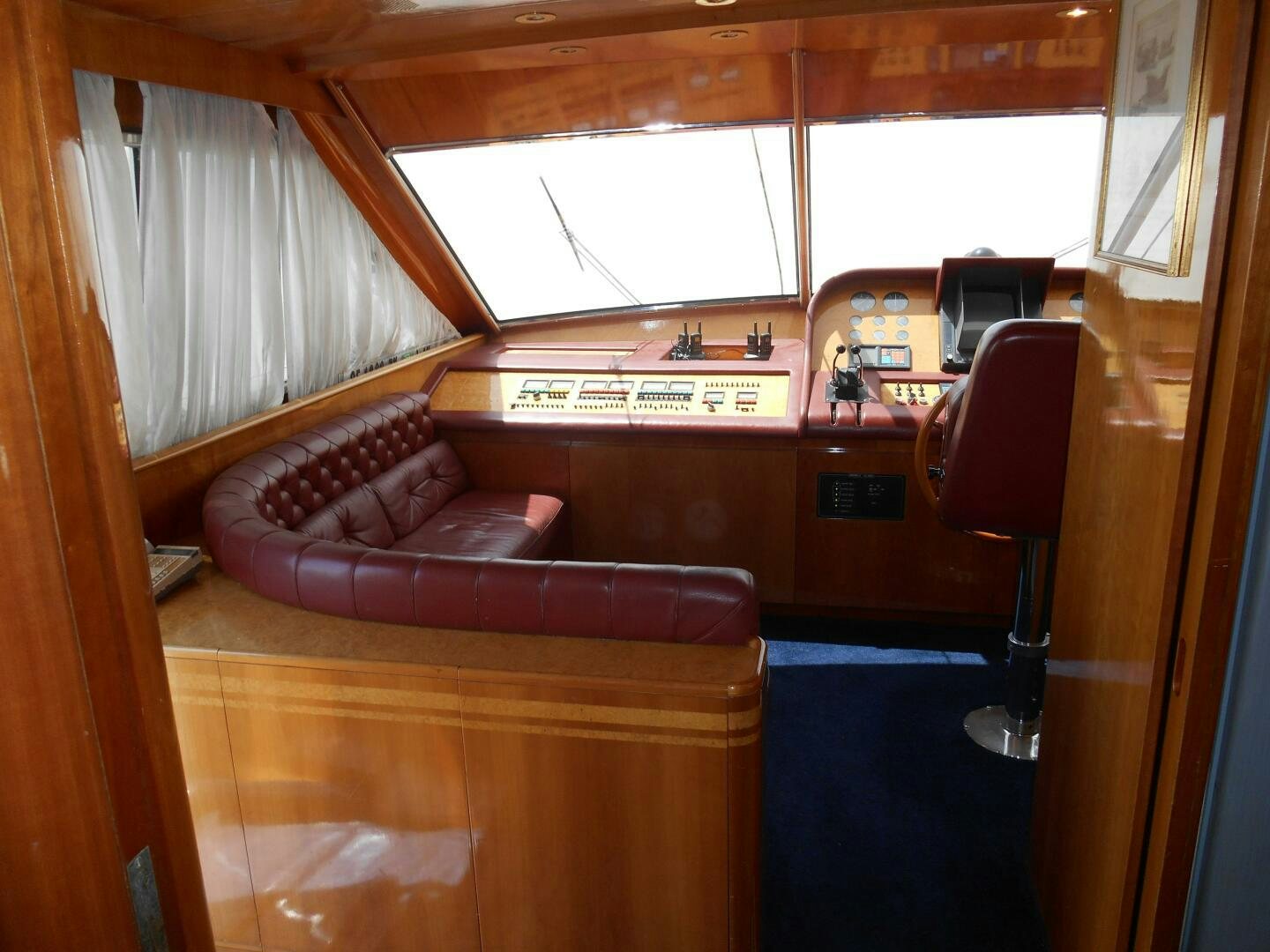 a room with a couch and a piano aboard LADY C Yacht for Sale