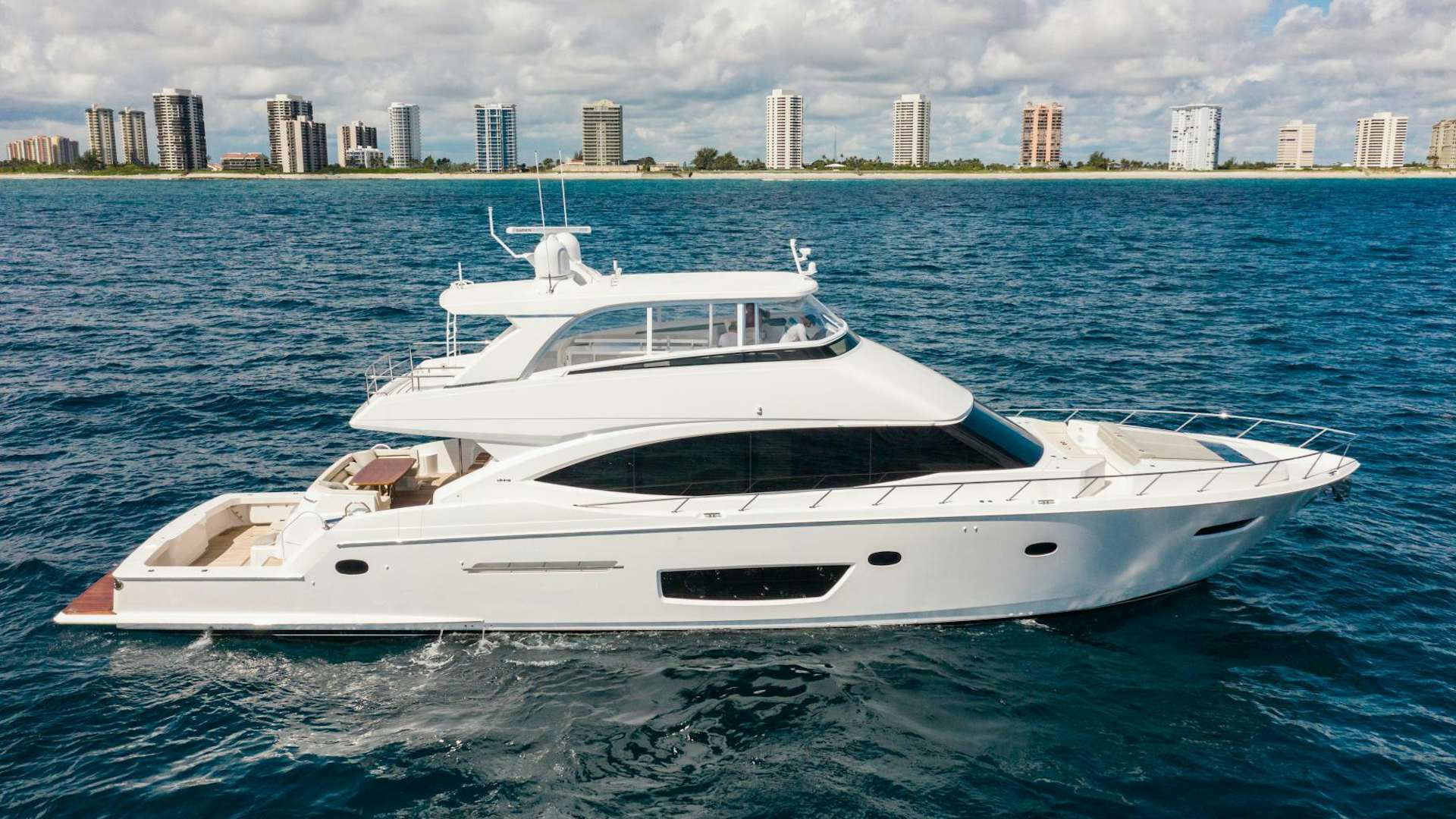 a white yacht in the water aboard MANA Yacht for Sale