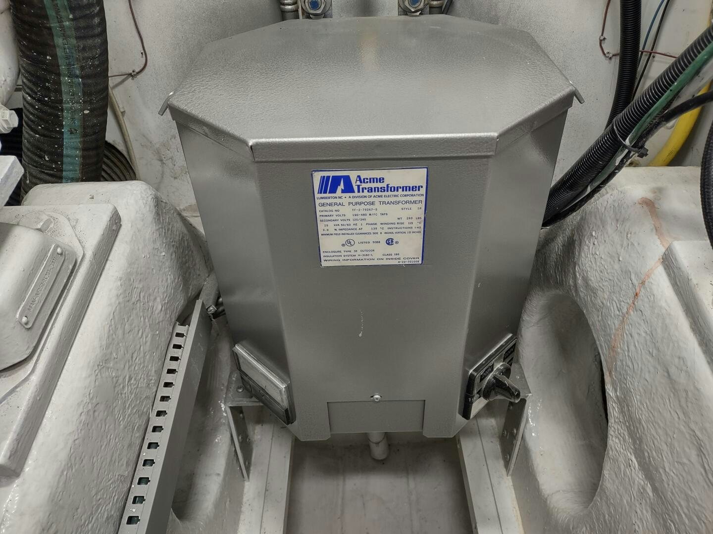 a grey metal box with a blue label on it aboard F66 Yacht for Sale