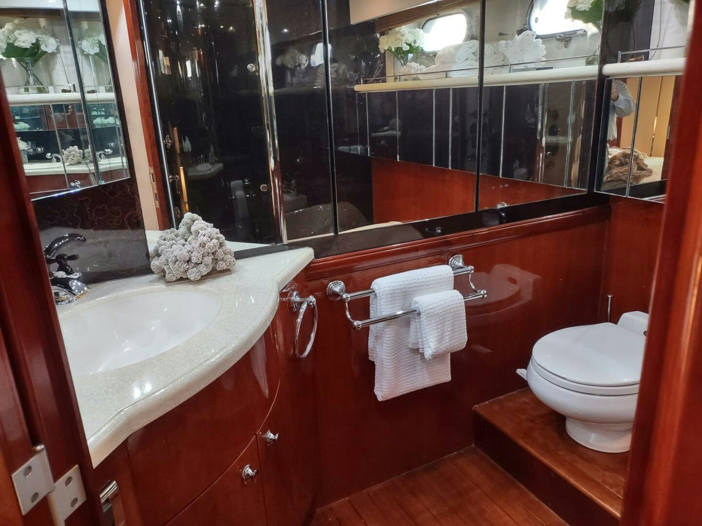 a bathroom with a large mirror aboard F66 Yacht for Sale