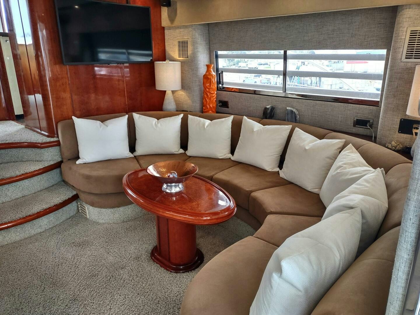 a living room with a couch and a table aboard F66 Yacht for Sale