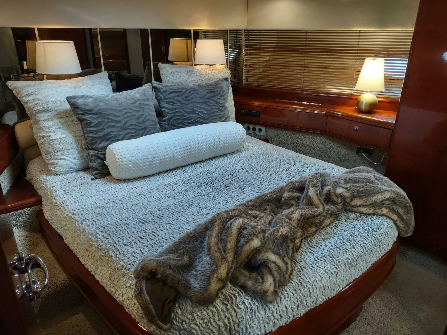 a large bed with pillows aboard F66 Yacht for Sale