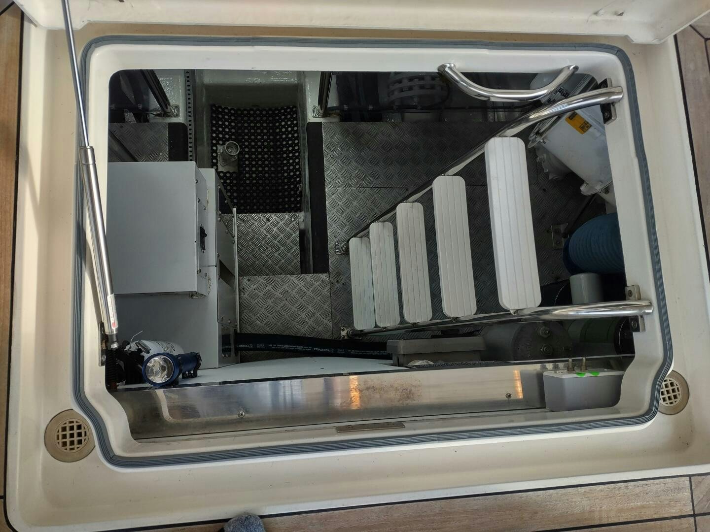 a car with its doors open aboard F66 Yacht for Sale