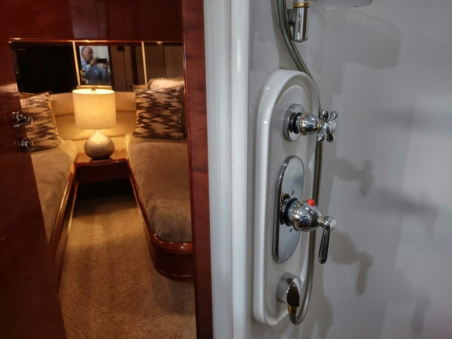 a bathroom with a mirror and a bed aboard F66 Yacht for Sale