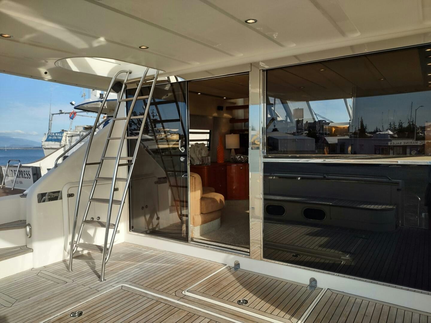 inside of a building with a staircase and glass doors aboard F66 Yacht for Sale