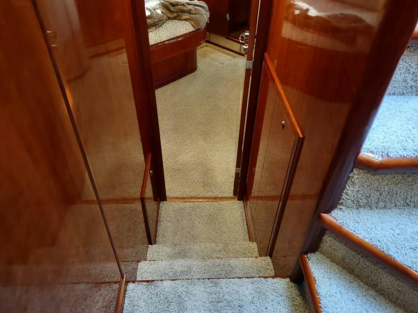 a wooden door with a stone walkway aboard F66 Yacht for Sale