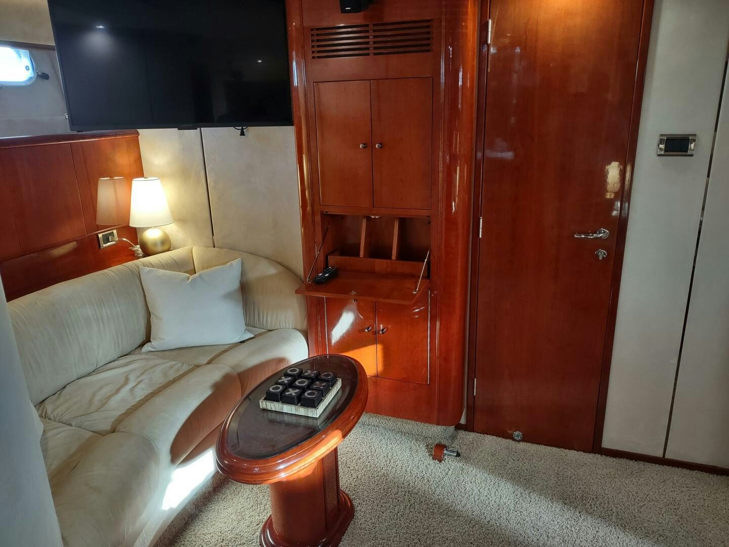 a living room with a couch and a coffee table aboard F66 Yacht for Sale